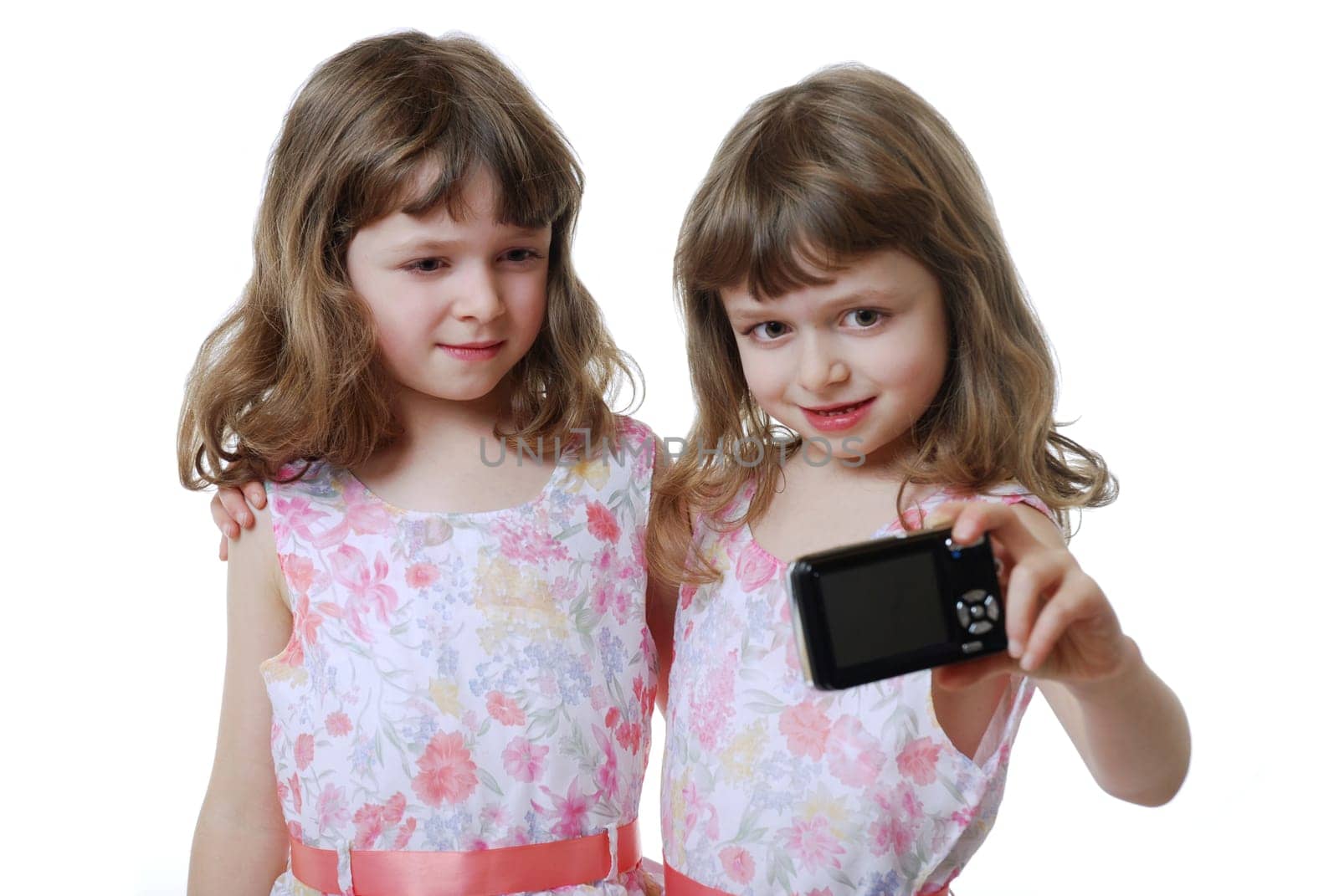 Twins with digital camera