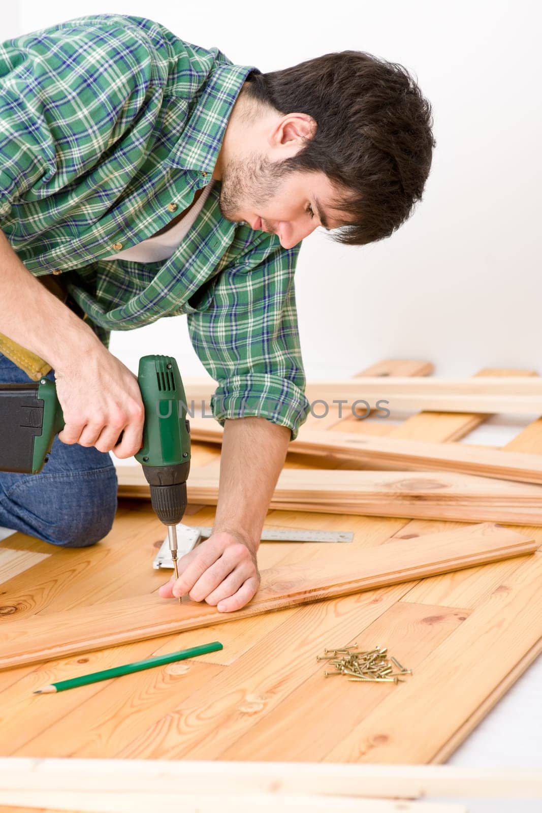 Home improvement - handyman installing wooden floor