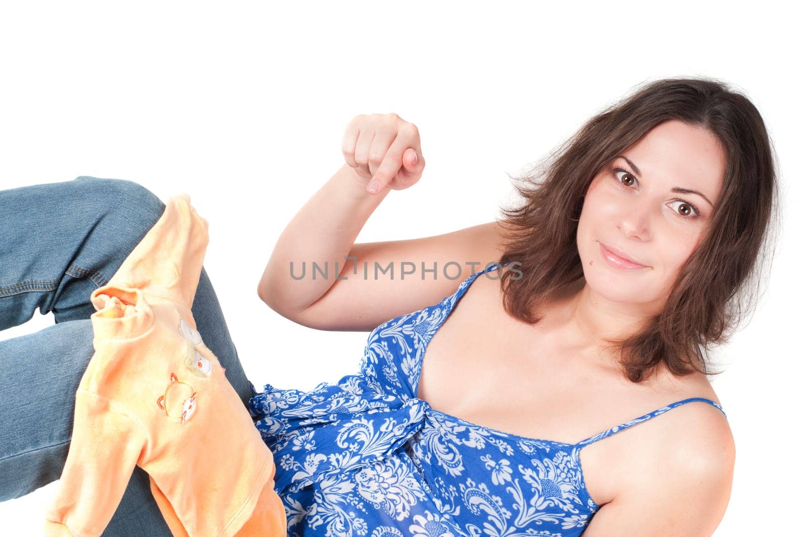 Portrait of pretty pregnant woman baby clothes