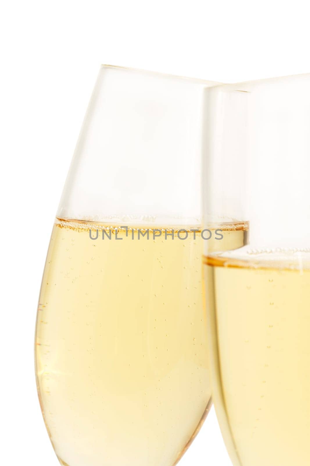 Slanted champagne glass behind others