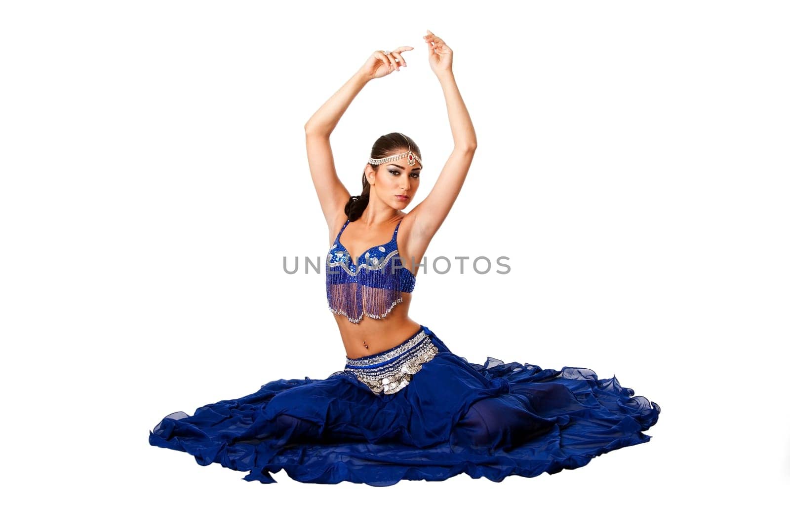 Arabic belly dancer sitting on floor