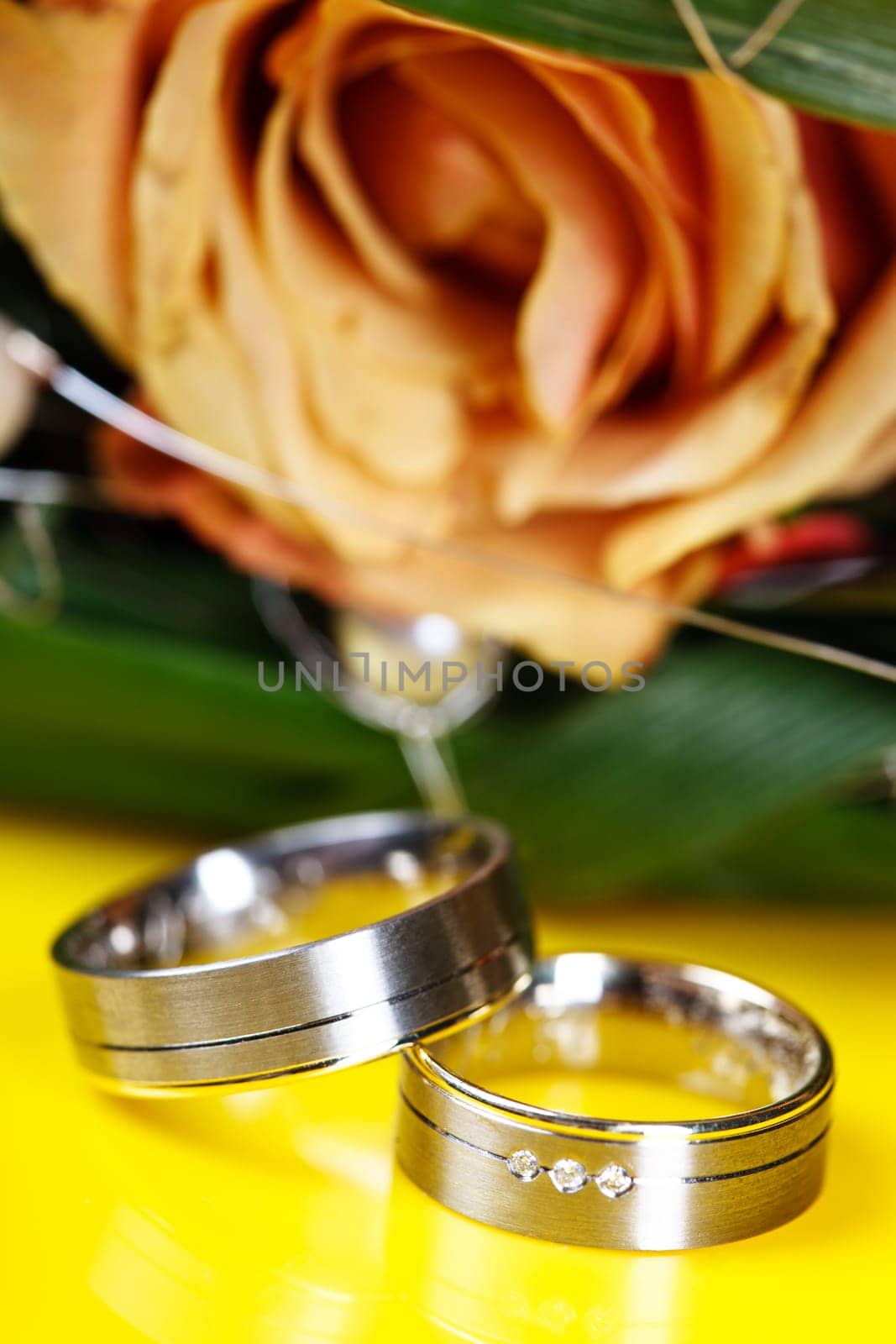 Wedding rings on yellow