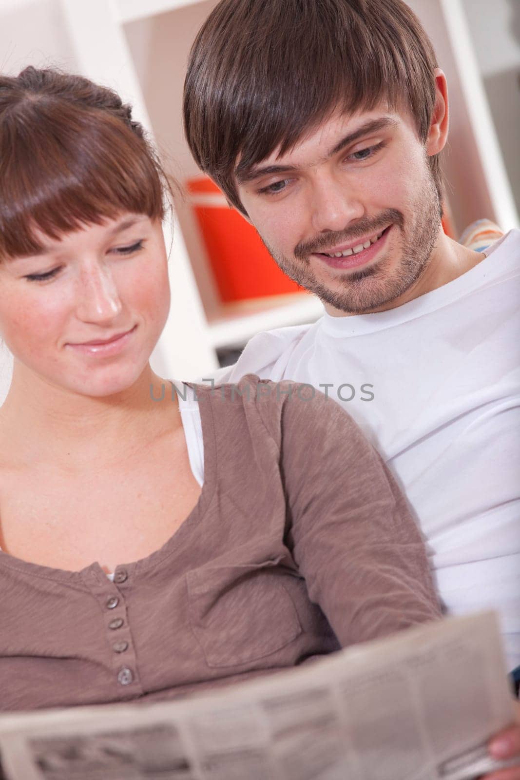 couple with newspaper