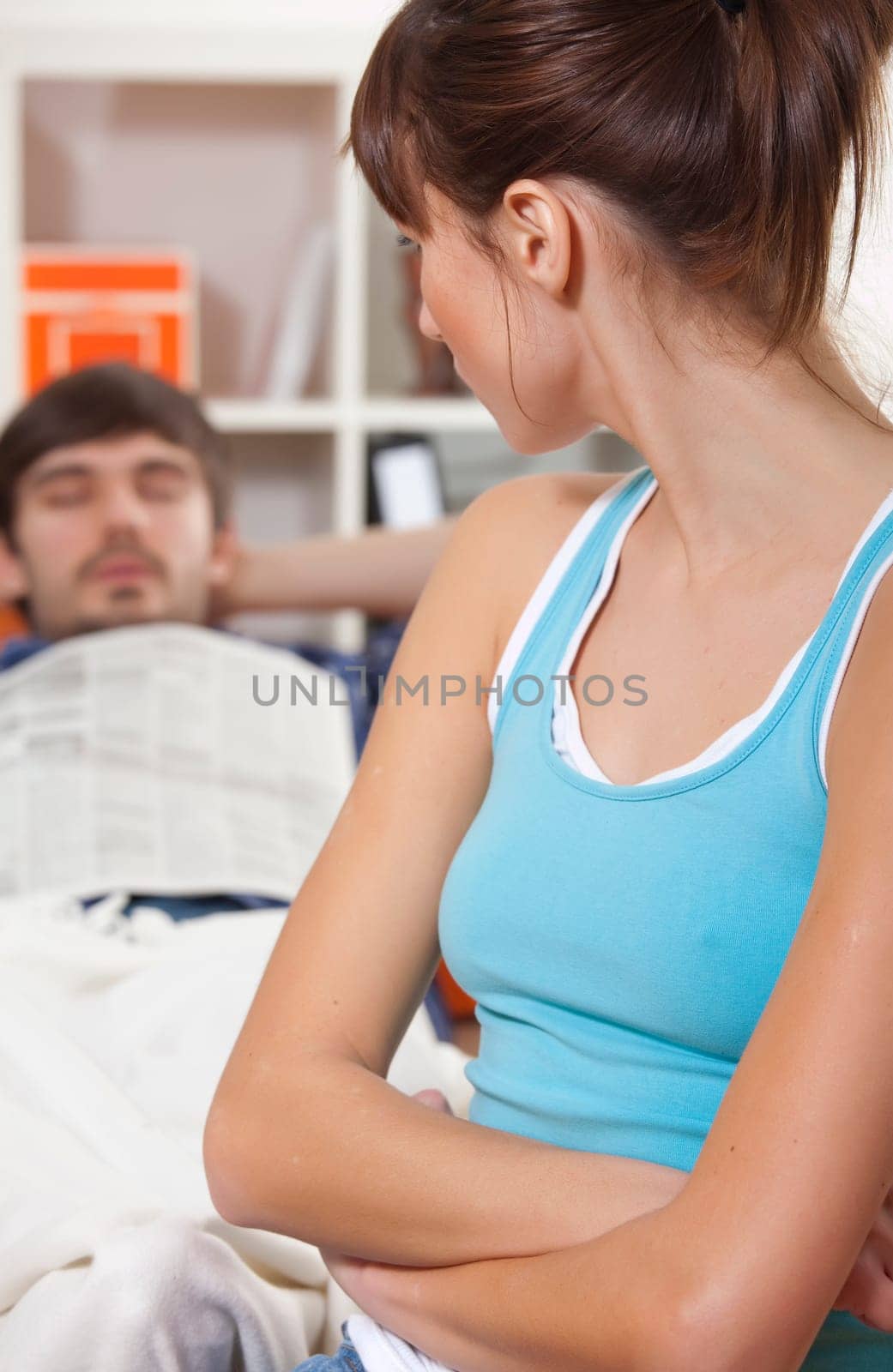 sleeping man ans sad woman