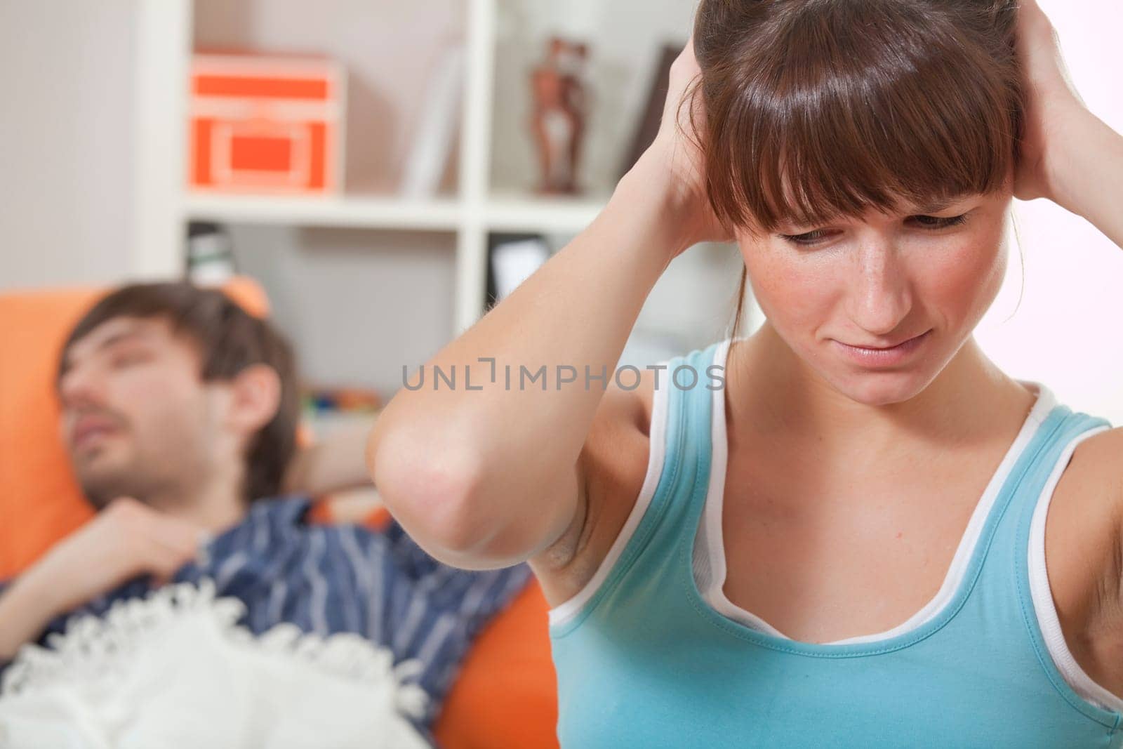 snoring man and frustrated woman