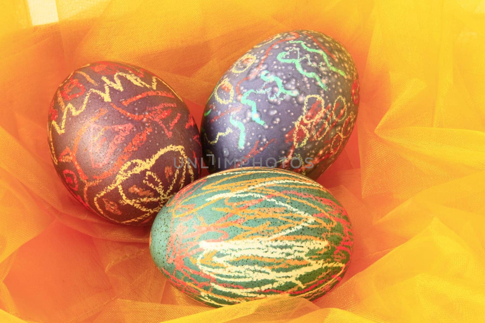 three colorful Easter eggs