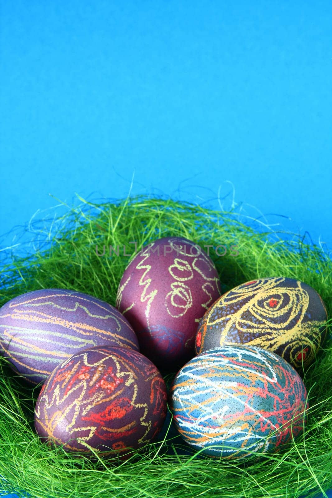 five brightly colored Easter eggs
