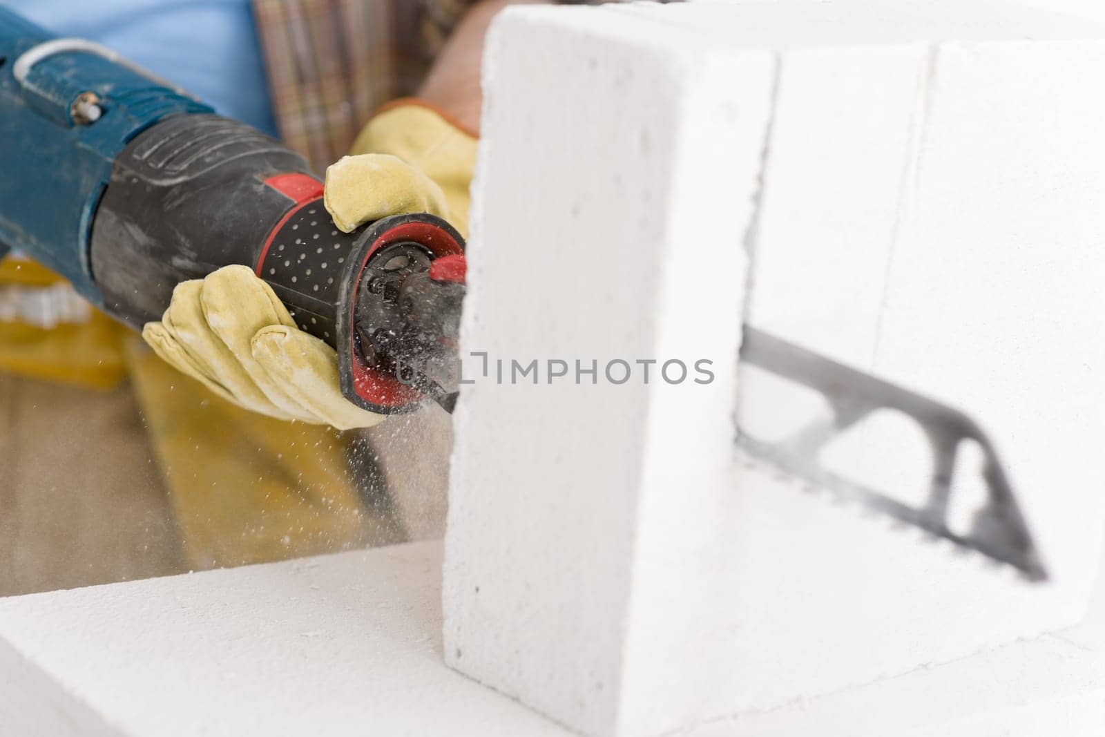Home improvement - handyman cut brick with saw