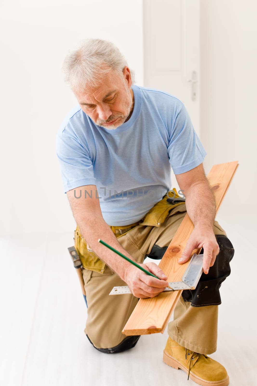 Home improvement - handyman installing wooden floor