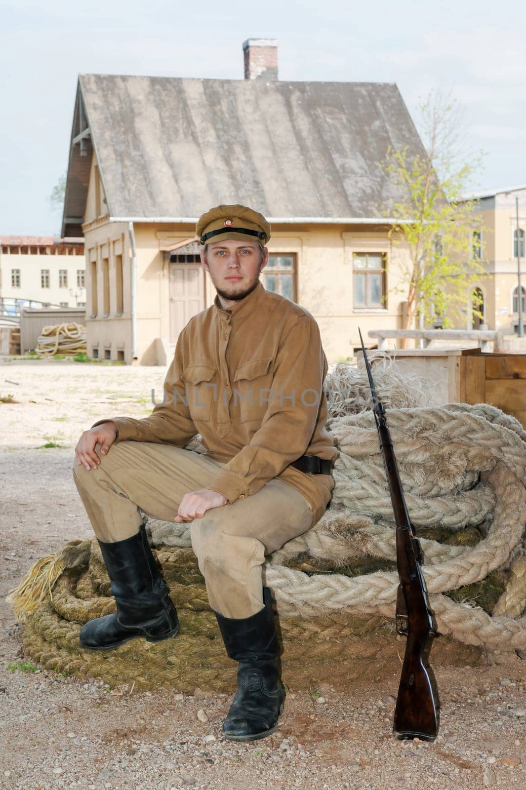 Retro style picture with soldier sitting