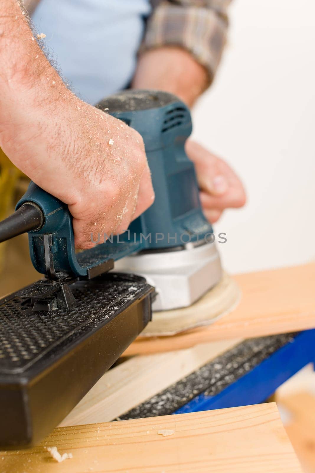 Home improvement - handyman sanding wooden floor
