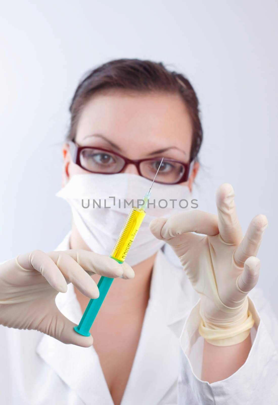 Female doctor with syringe