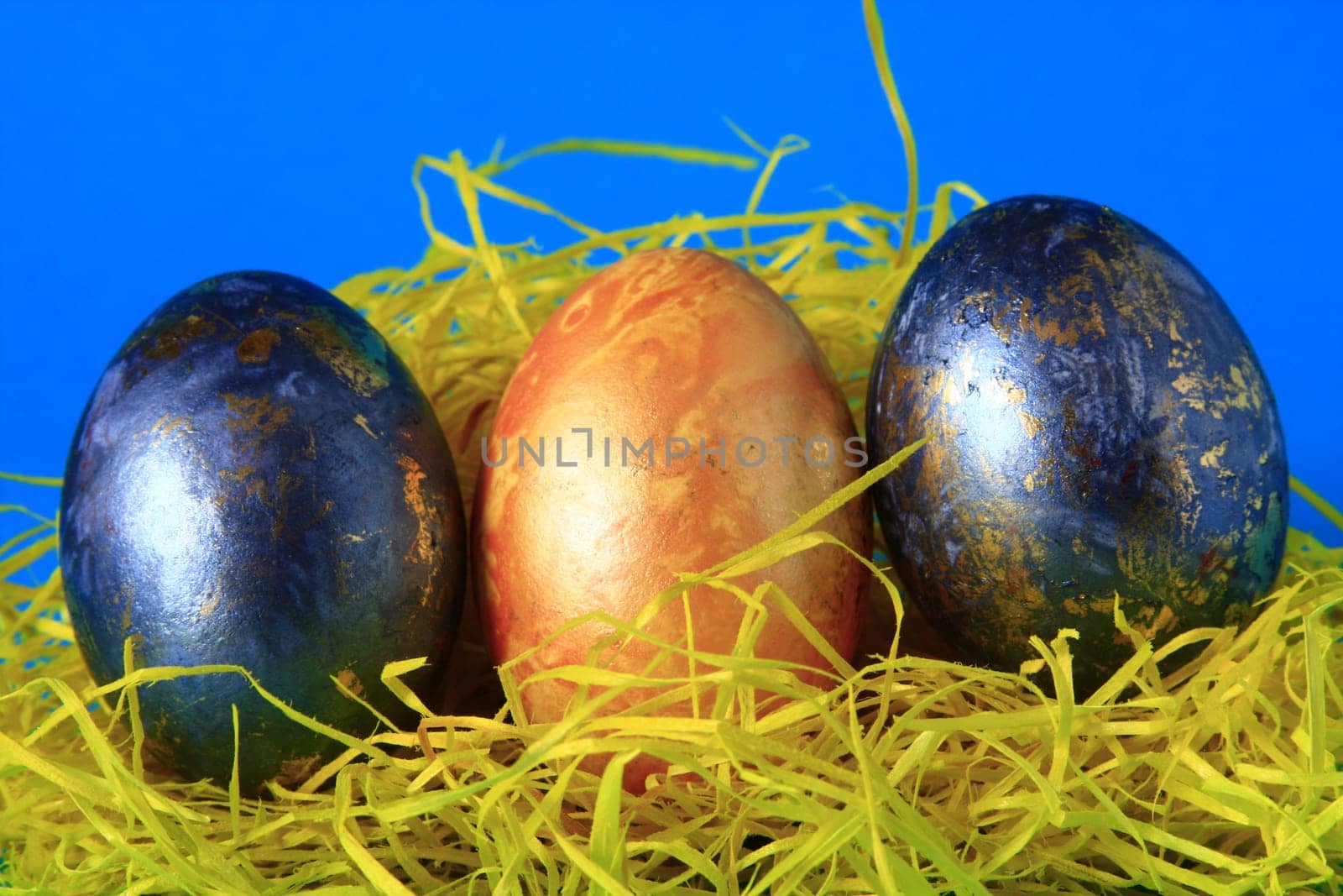 three colorful Easter eggs