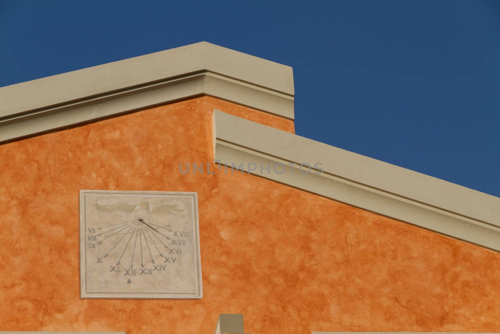 Sundial on the house façade
