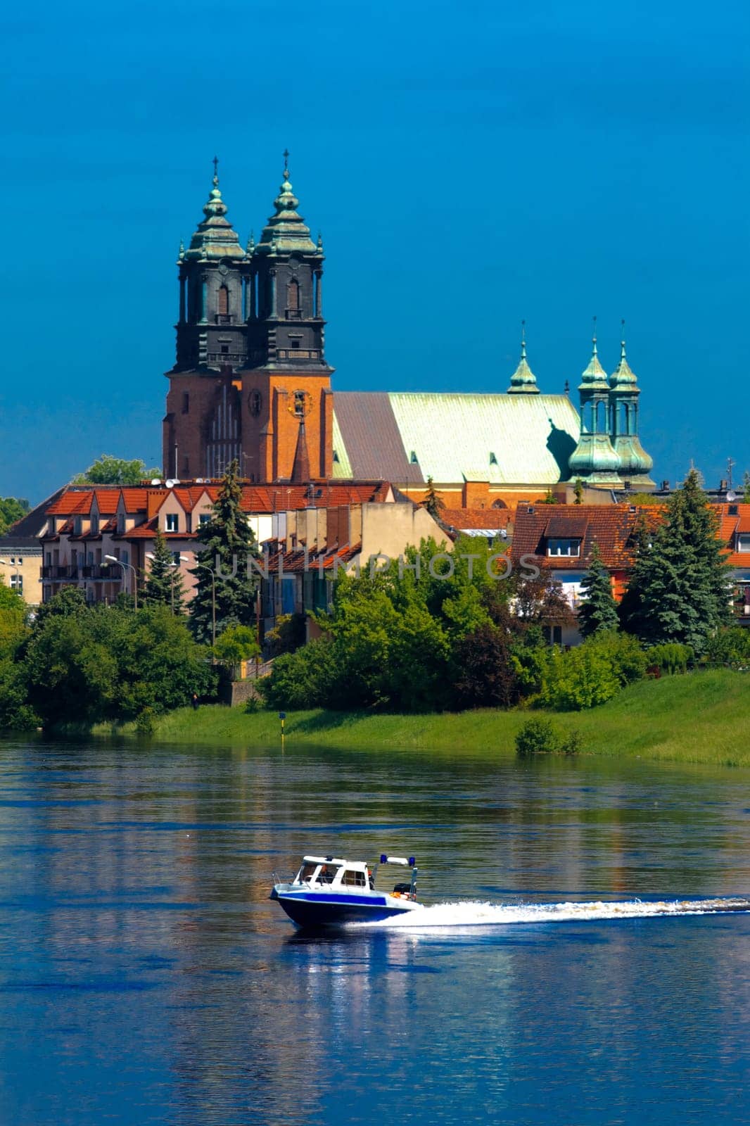 River, motorboat and a cathedral church