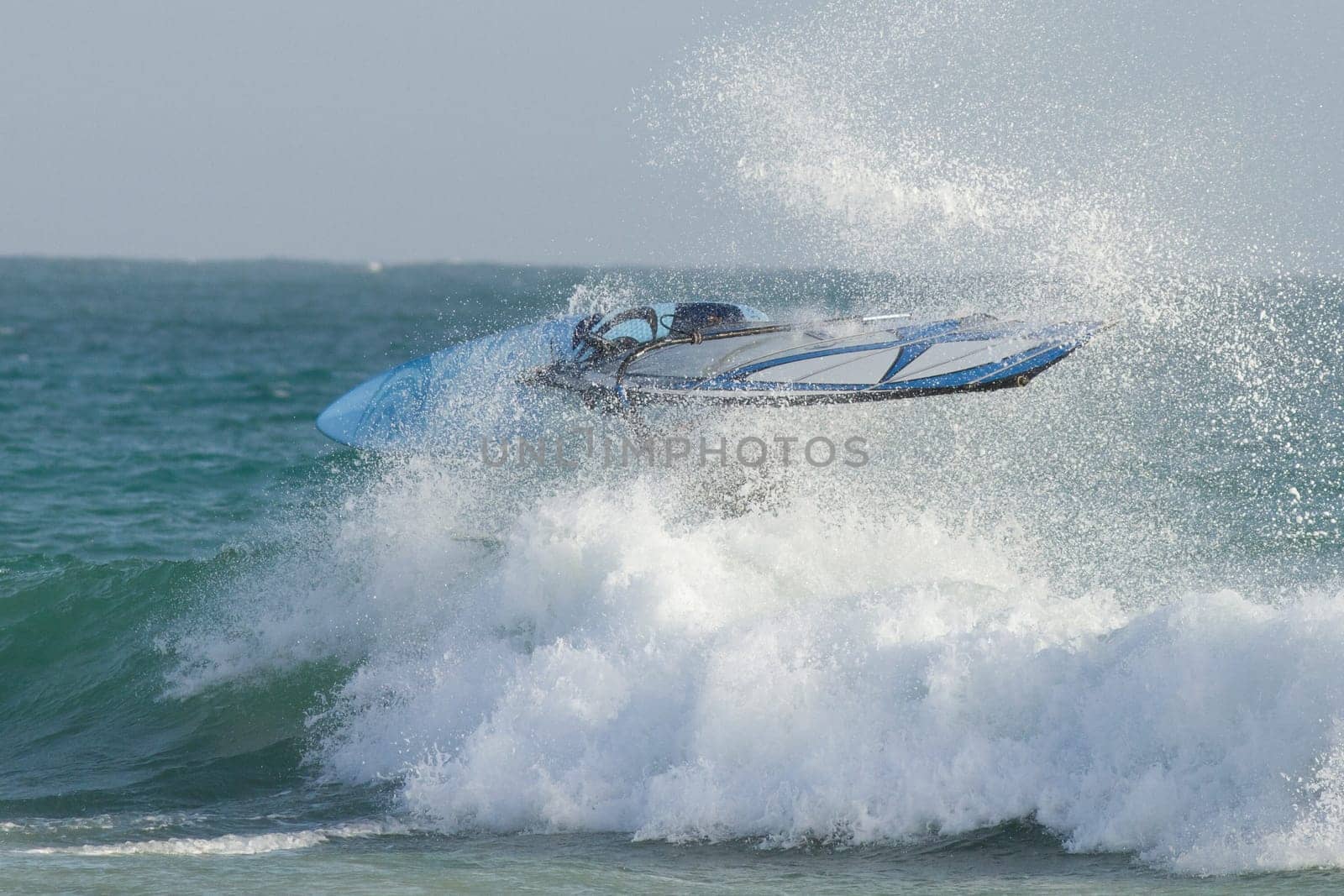 Windsurfers by the sea