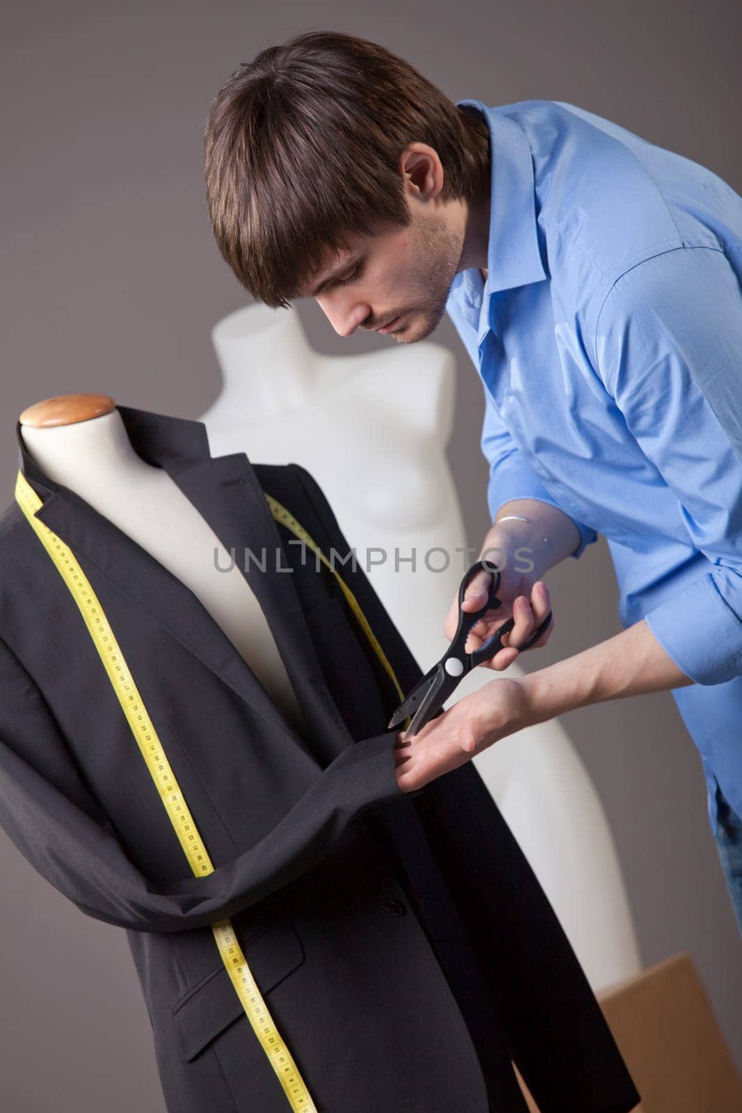 tailor working on jacket