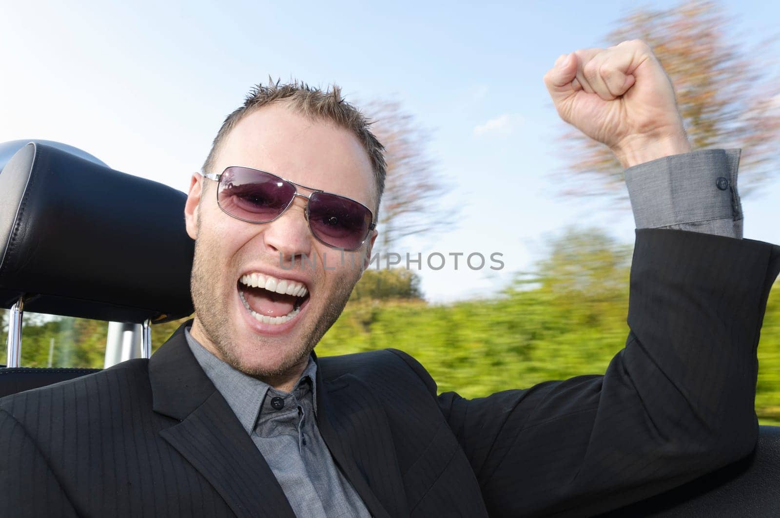 Young man driving convertible