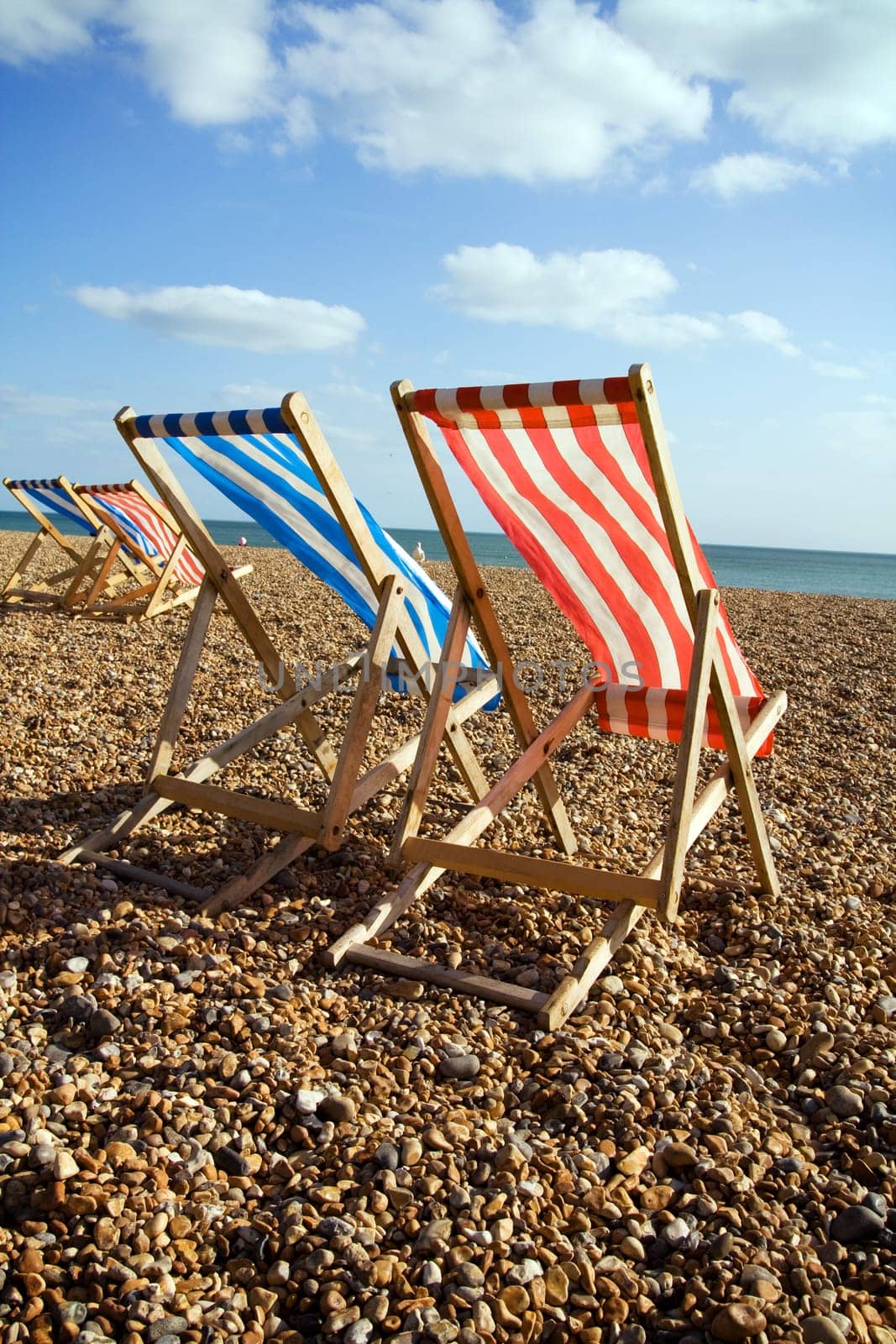 deckchairs beach sea windy