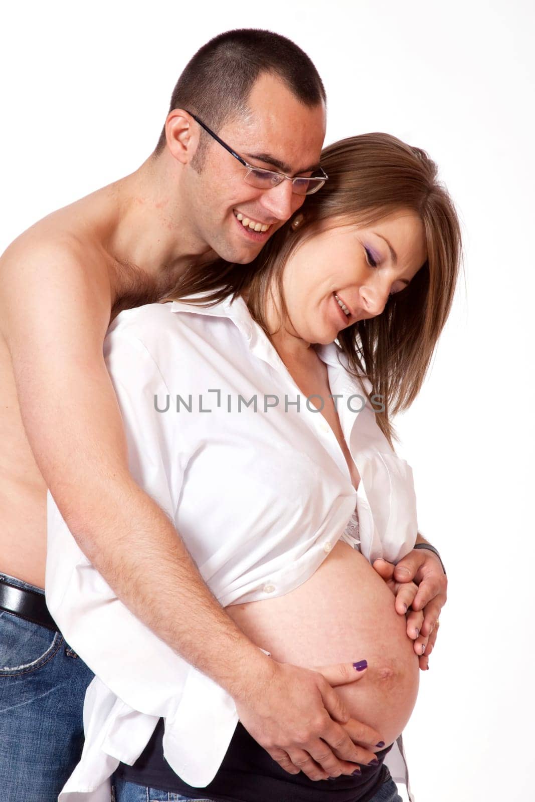 Happy young man and his pregnant wife