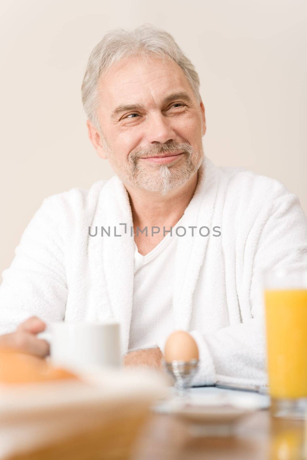 Senior mature man - breakfast at home