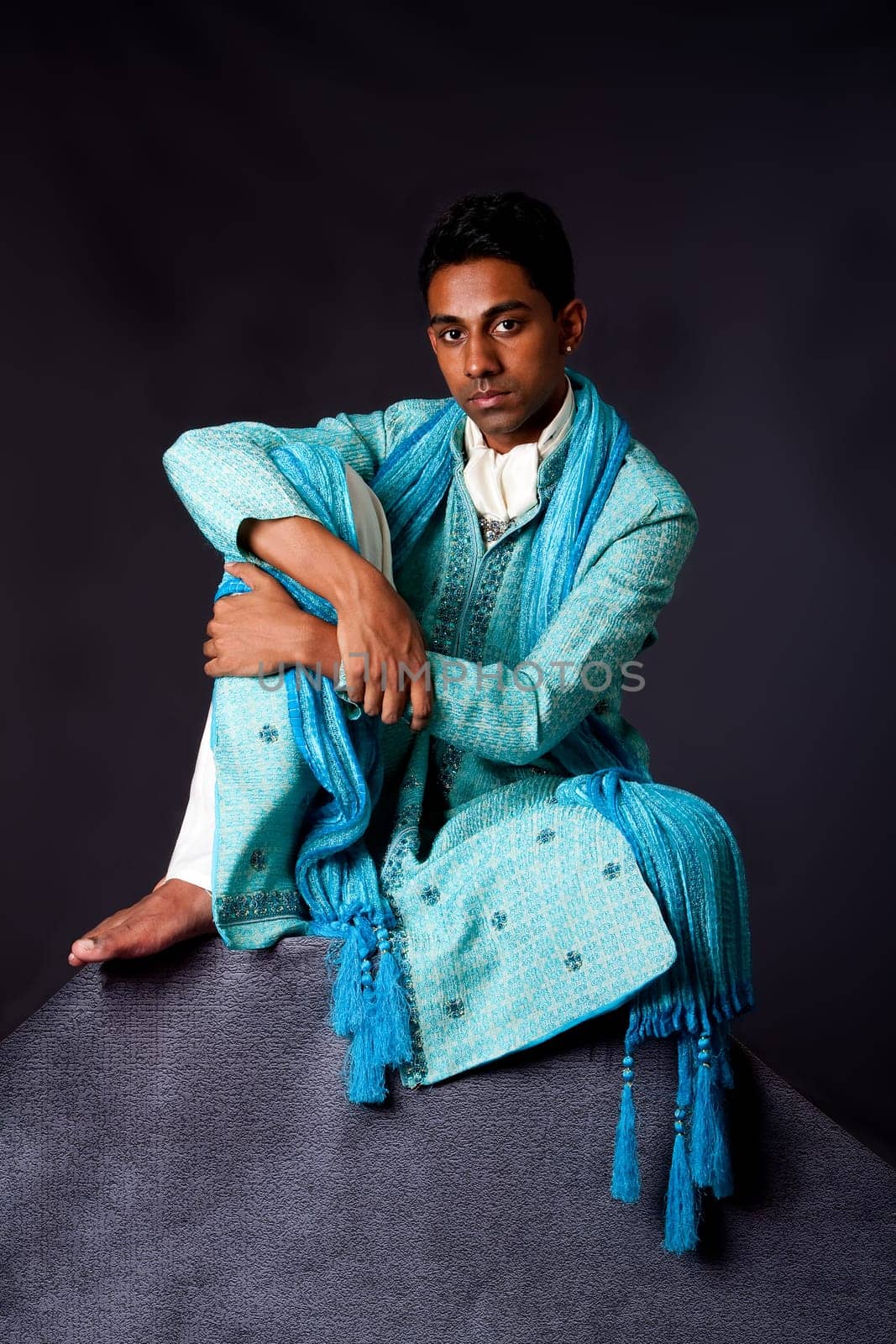 Hindu man sitting on rock