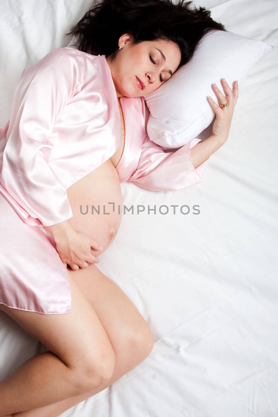 Sleeping Pregnant woman in bed