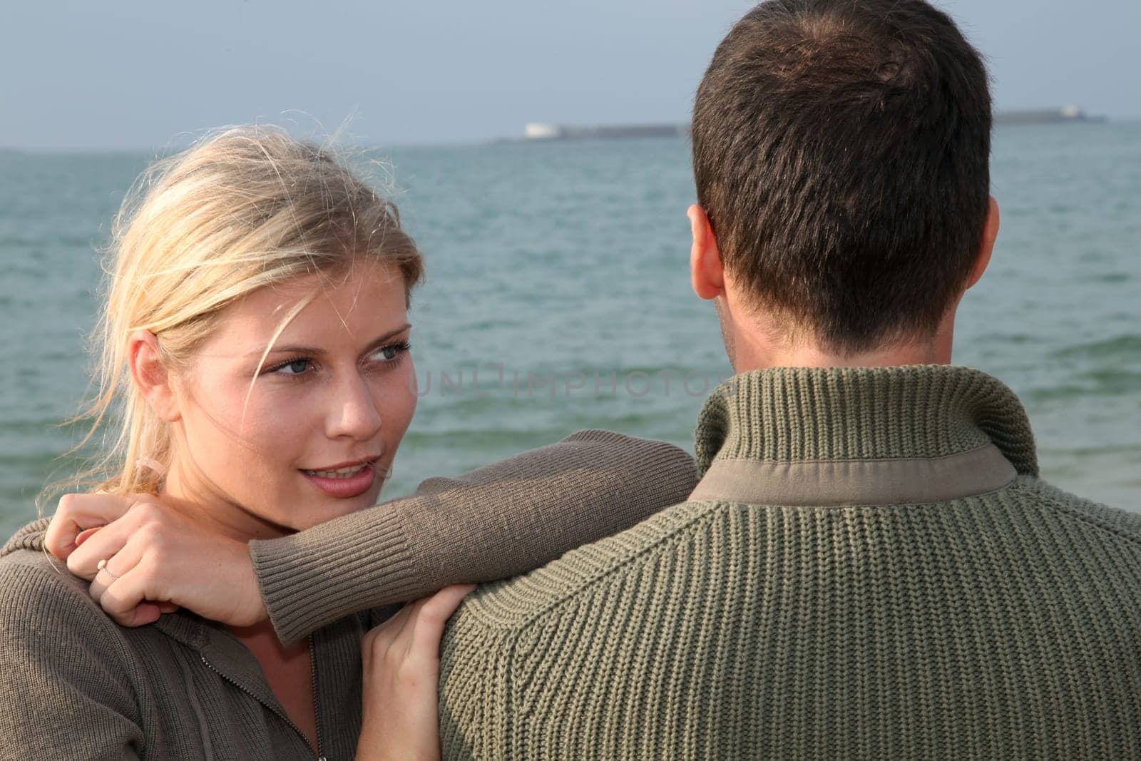 Lovers at the beach in autumn