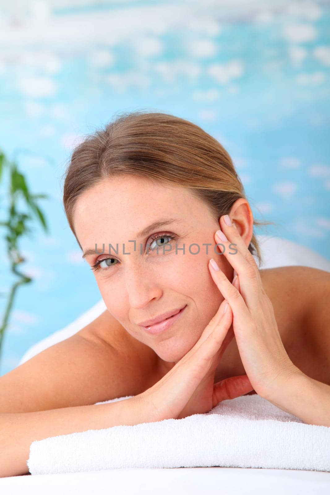 Closeup of beautiful blond woman on a massage bed