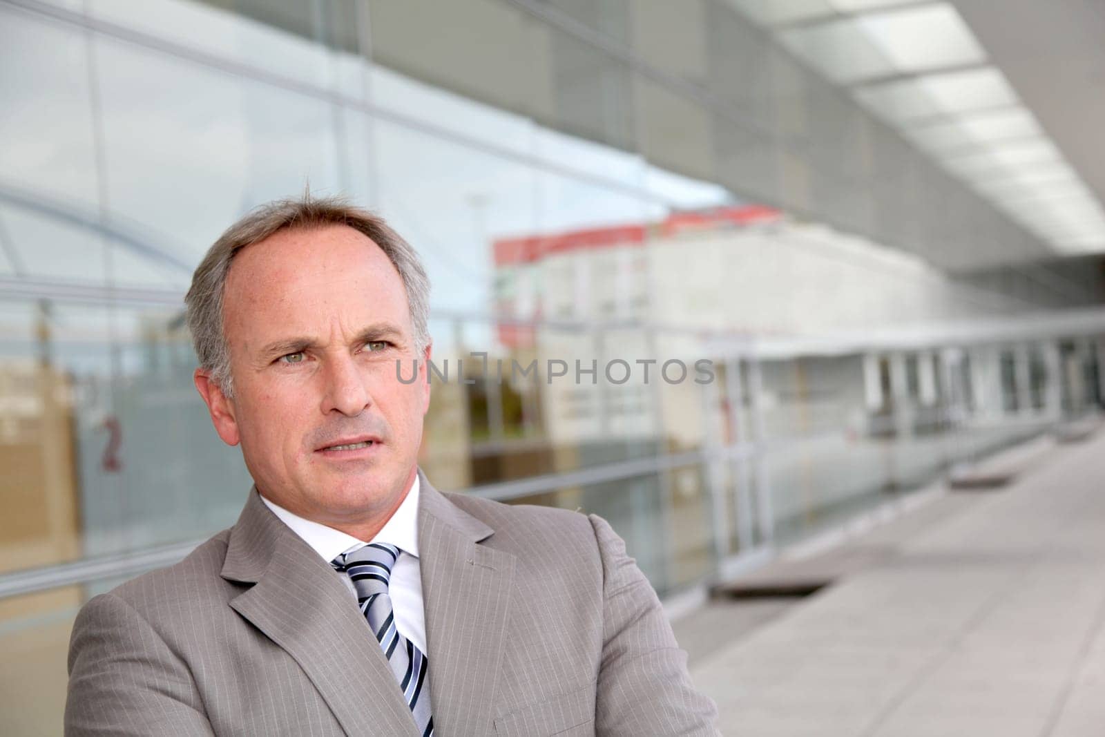 Businessman standing outside modern building