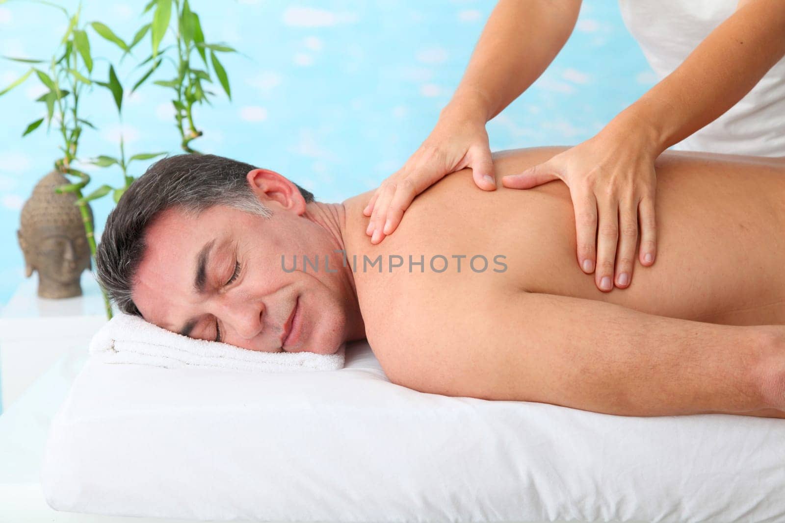 Man having a massage in a spa center