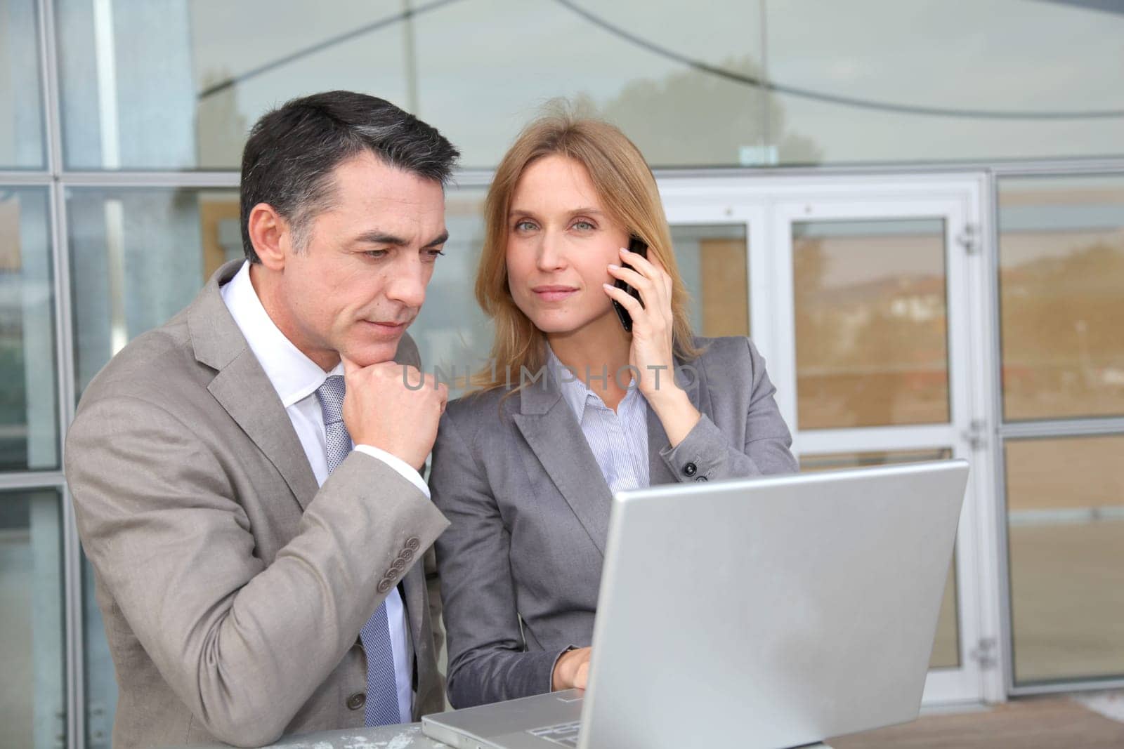 Sales people working outside modern building
