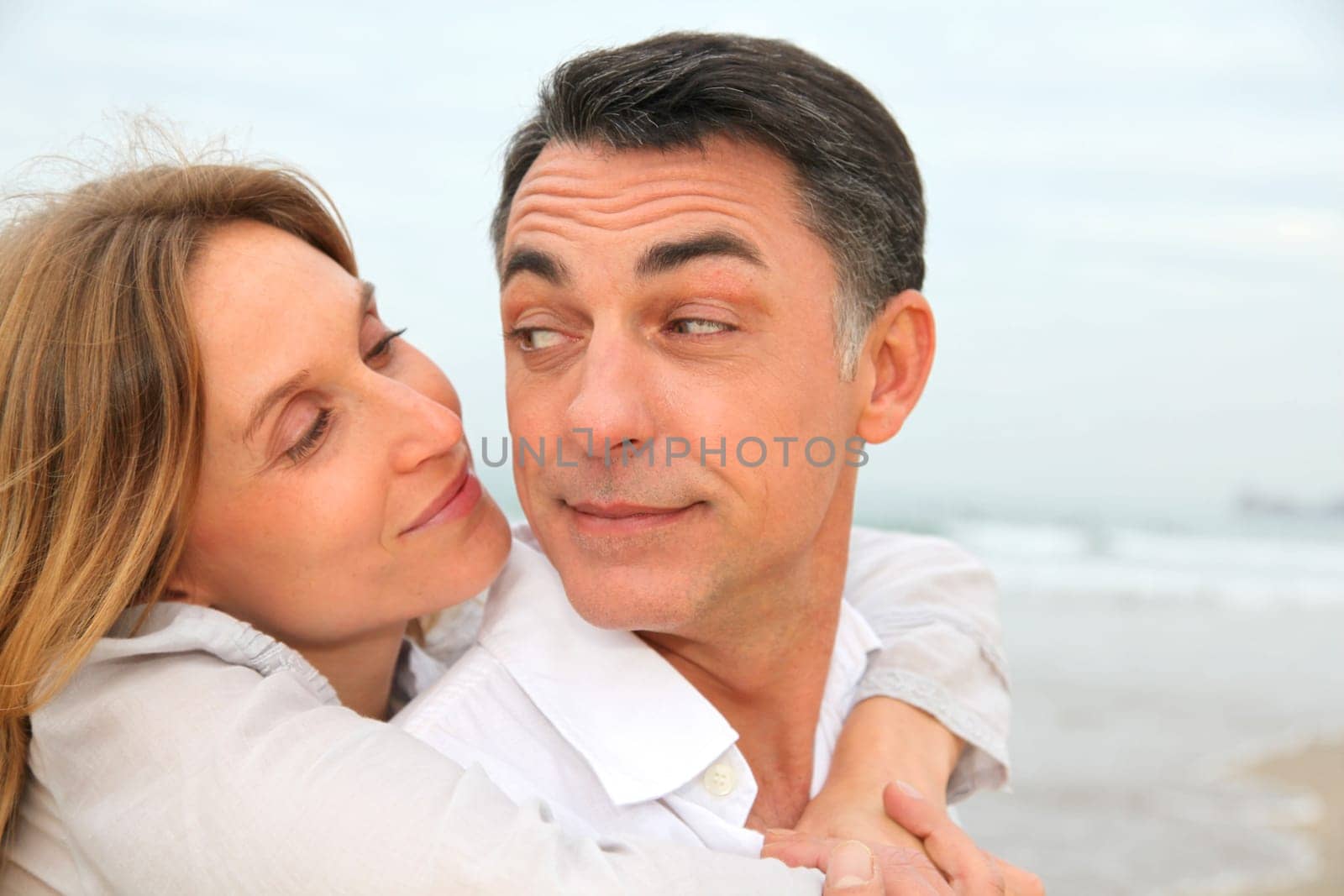Couple embracing each other at the beach