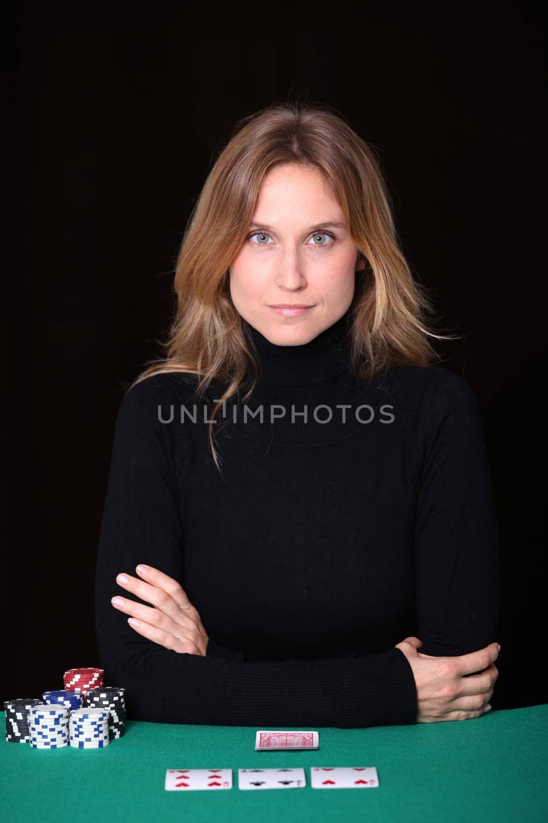 Woman sitting at poker table