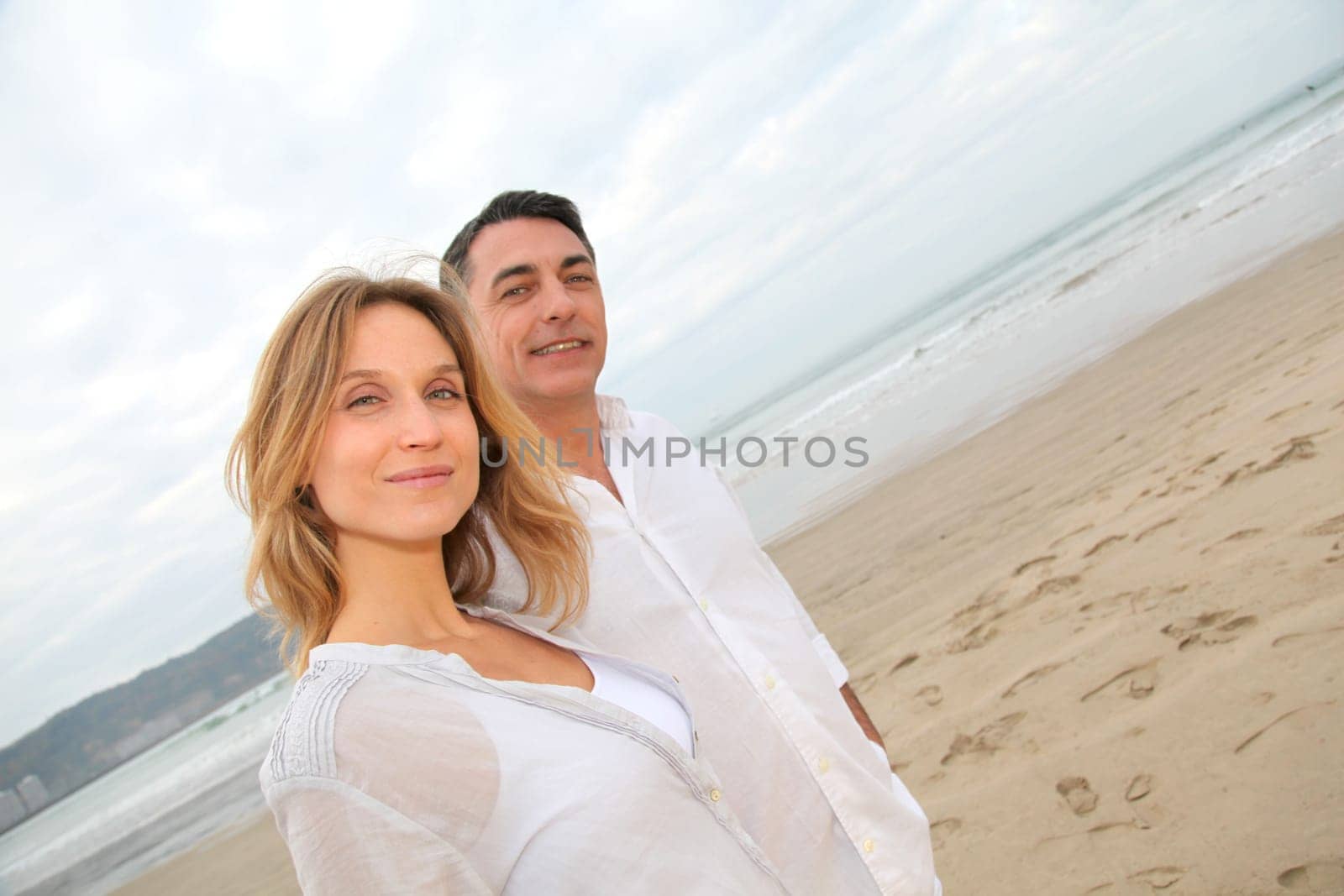 Couple walking by the beach