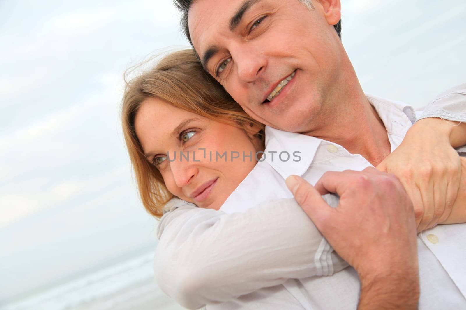 Couple embracing each other at the beach