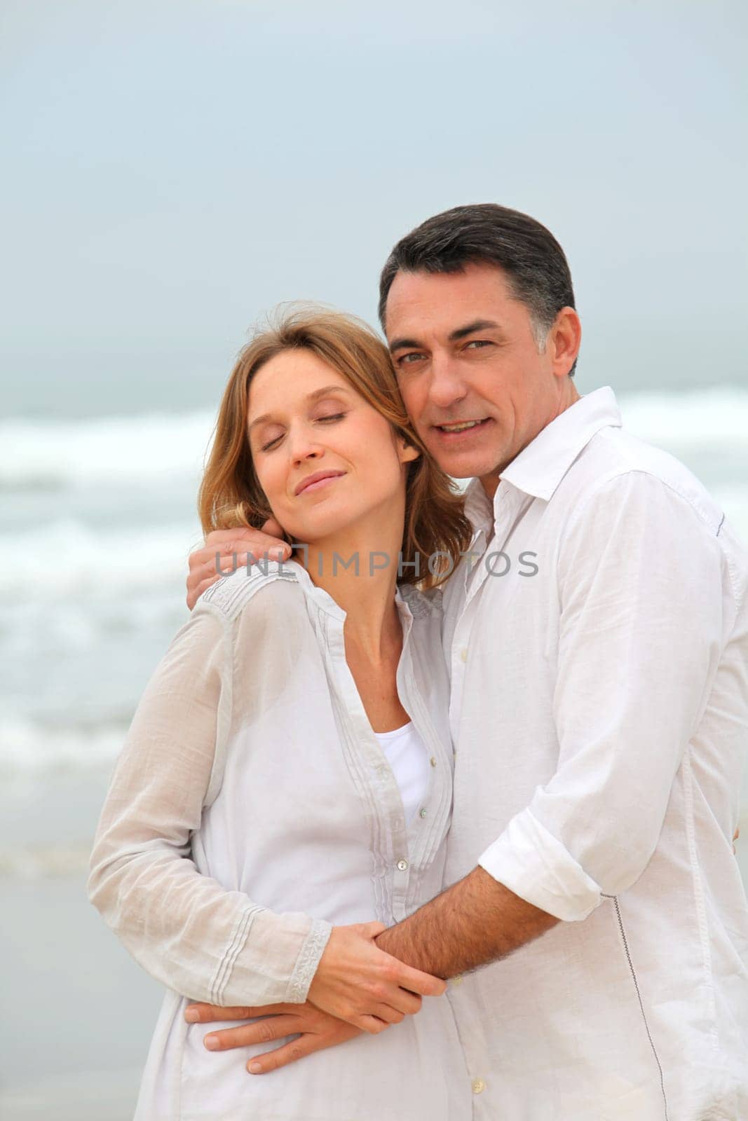 Couple walking by the beach