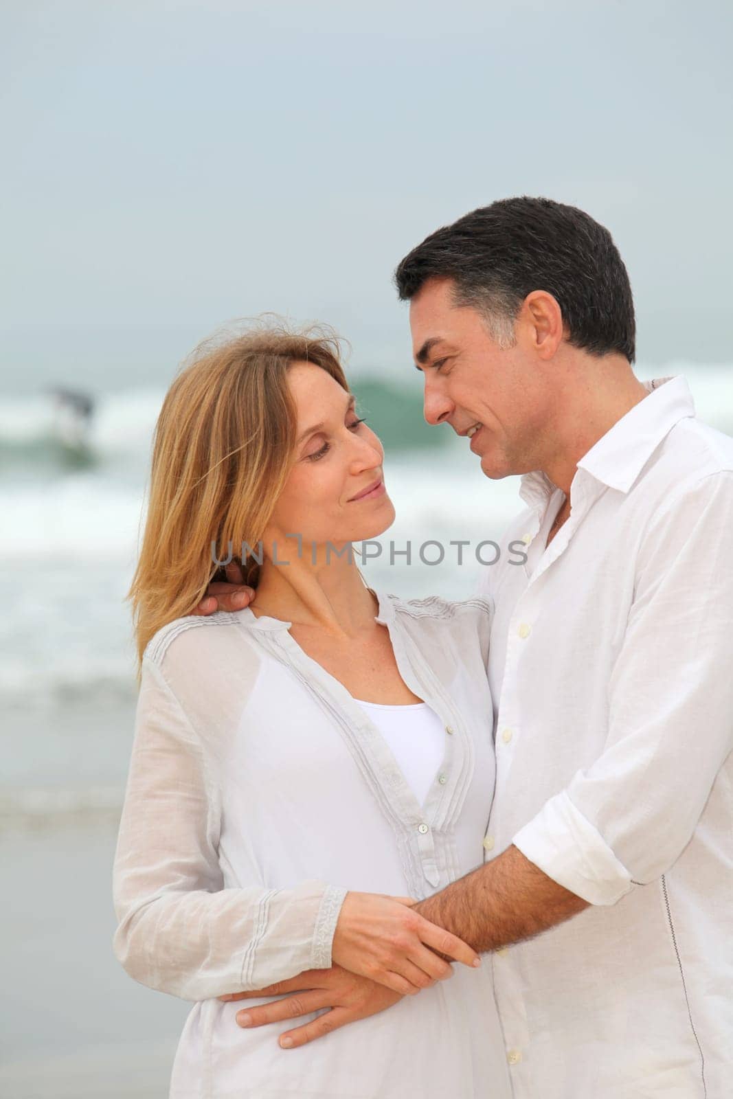 Couple walking by the beach