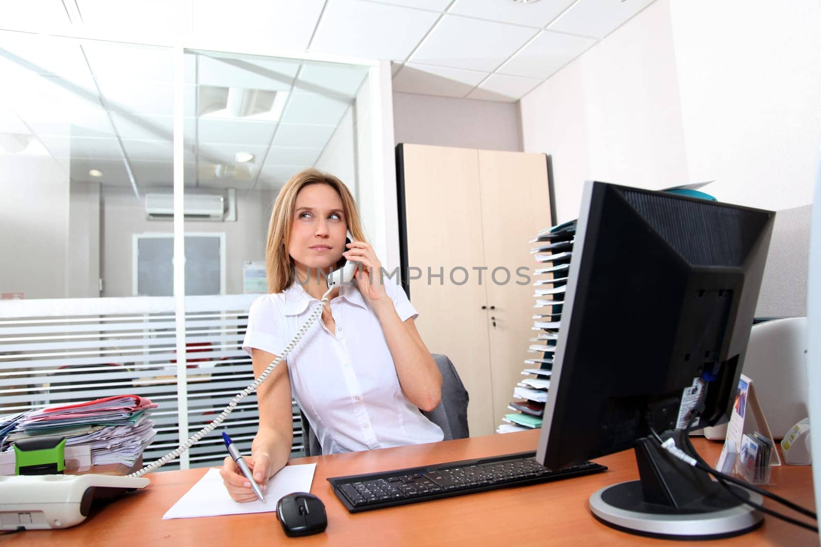 Woman talking on the phone in the office