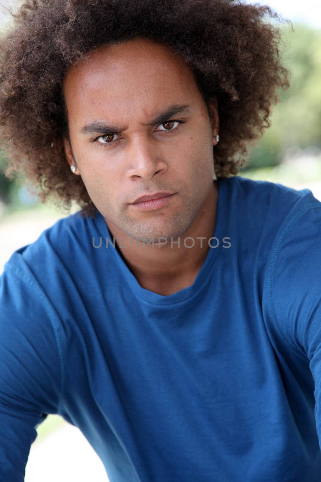 Closeup of young man with worried look