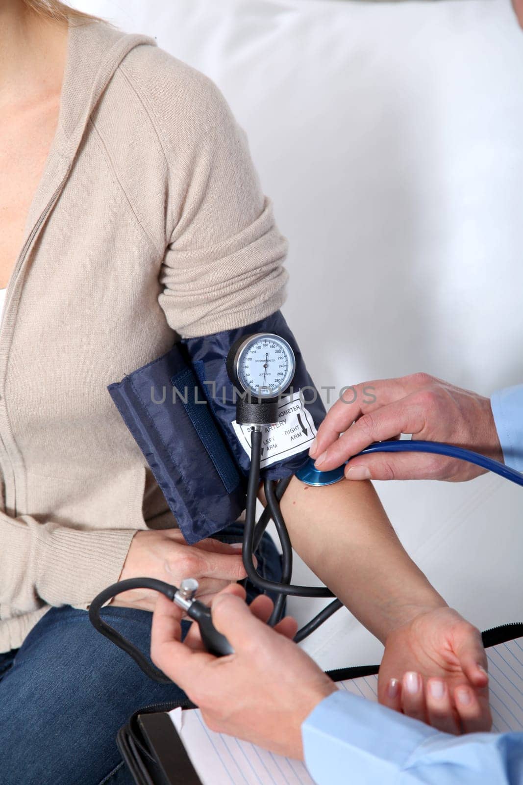 Doctor measuring blood pressure
