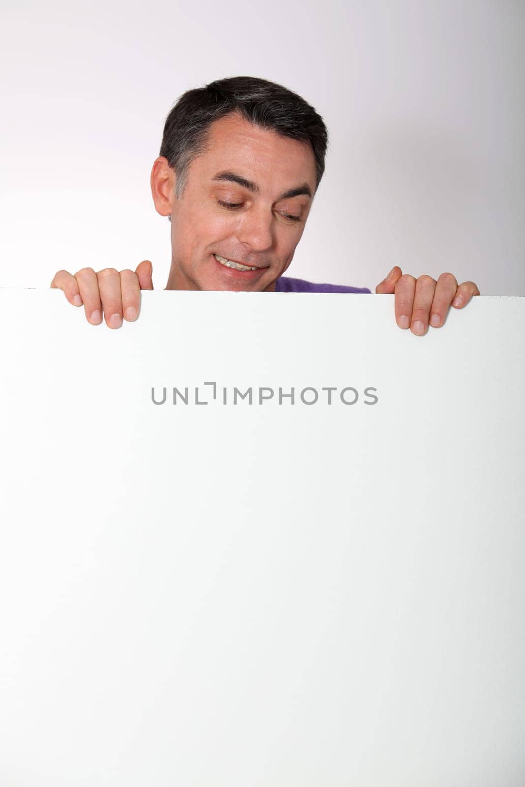 man showing message board