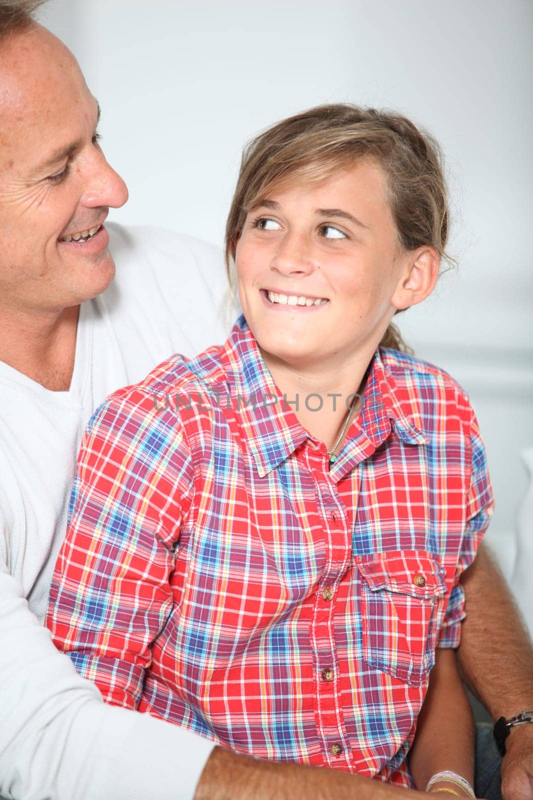 Closeup of father and daughter at home