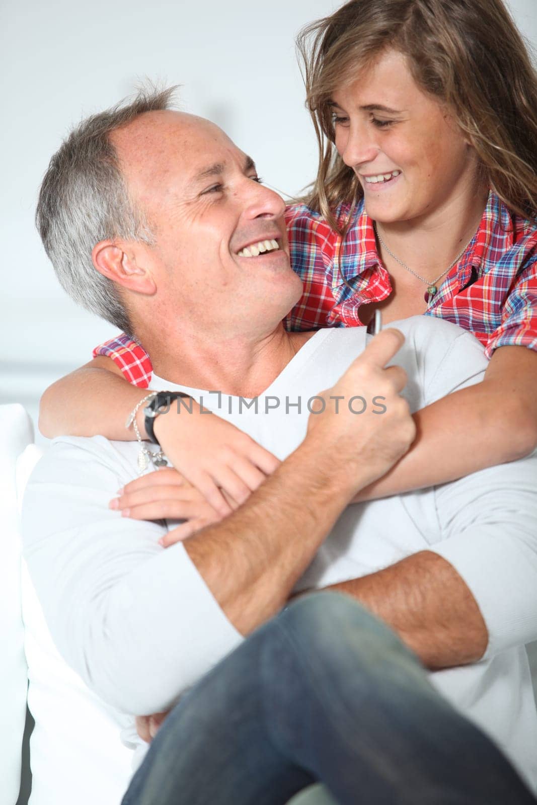 Closeup of father and daughter at home