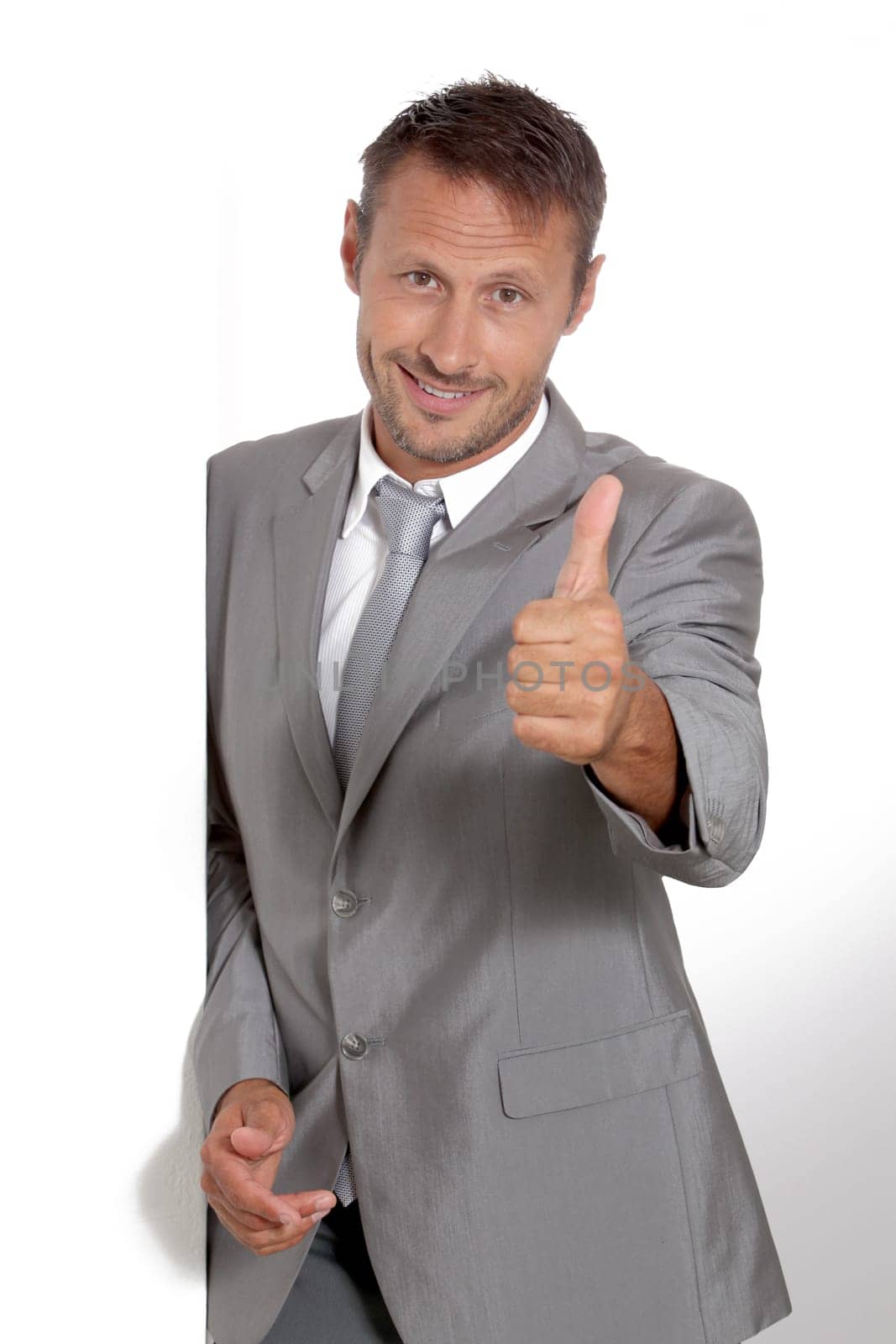 Businessman doing expressions on white background