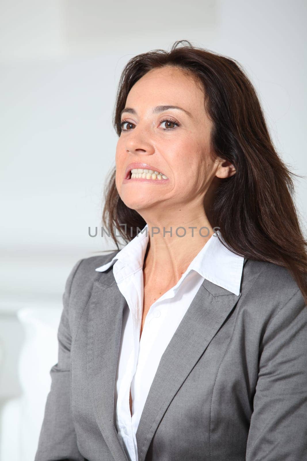 Businesswoman doing weird face
