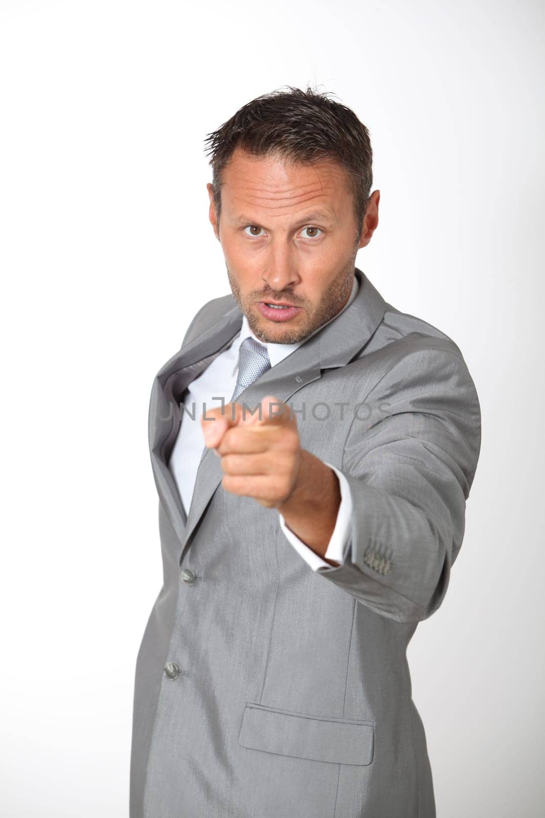 Businessman pointing at camera