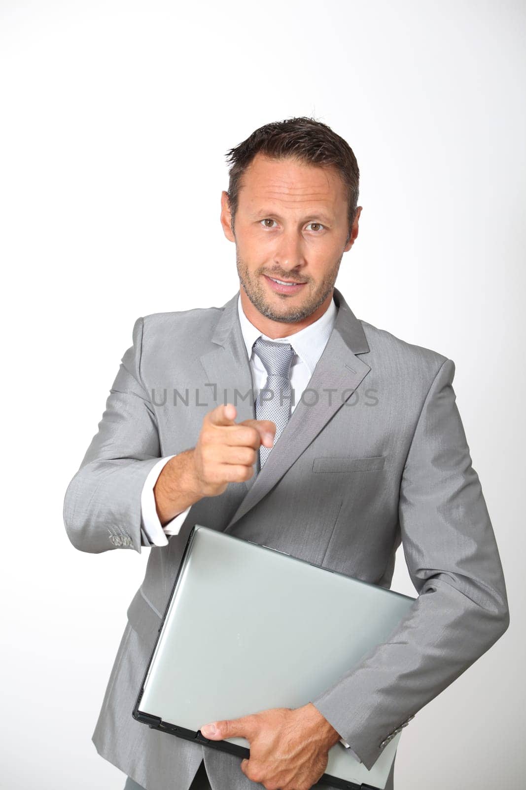 Businessman pointing at camera