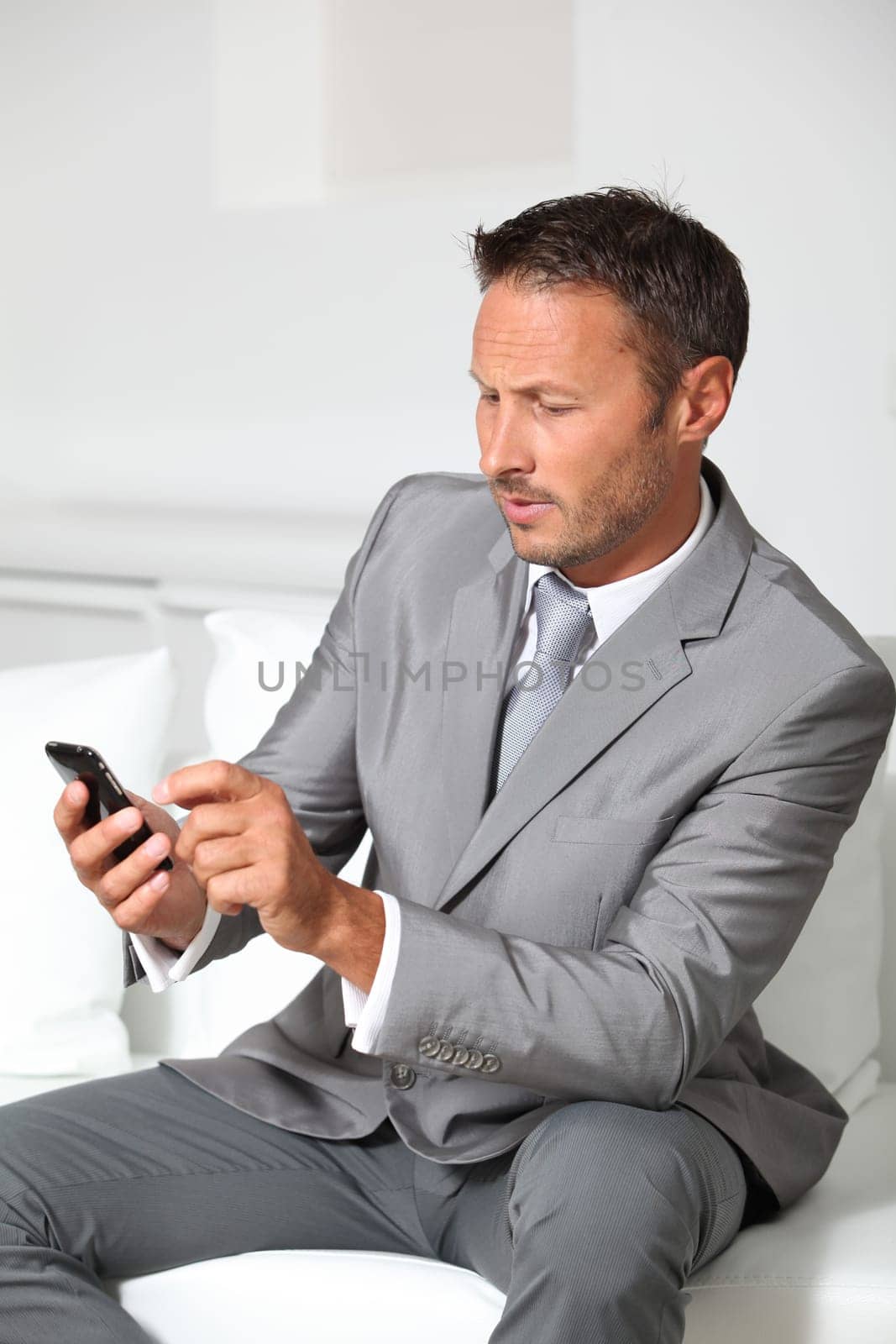 Closeup of businessman talking on mobile phone