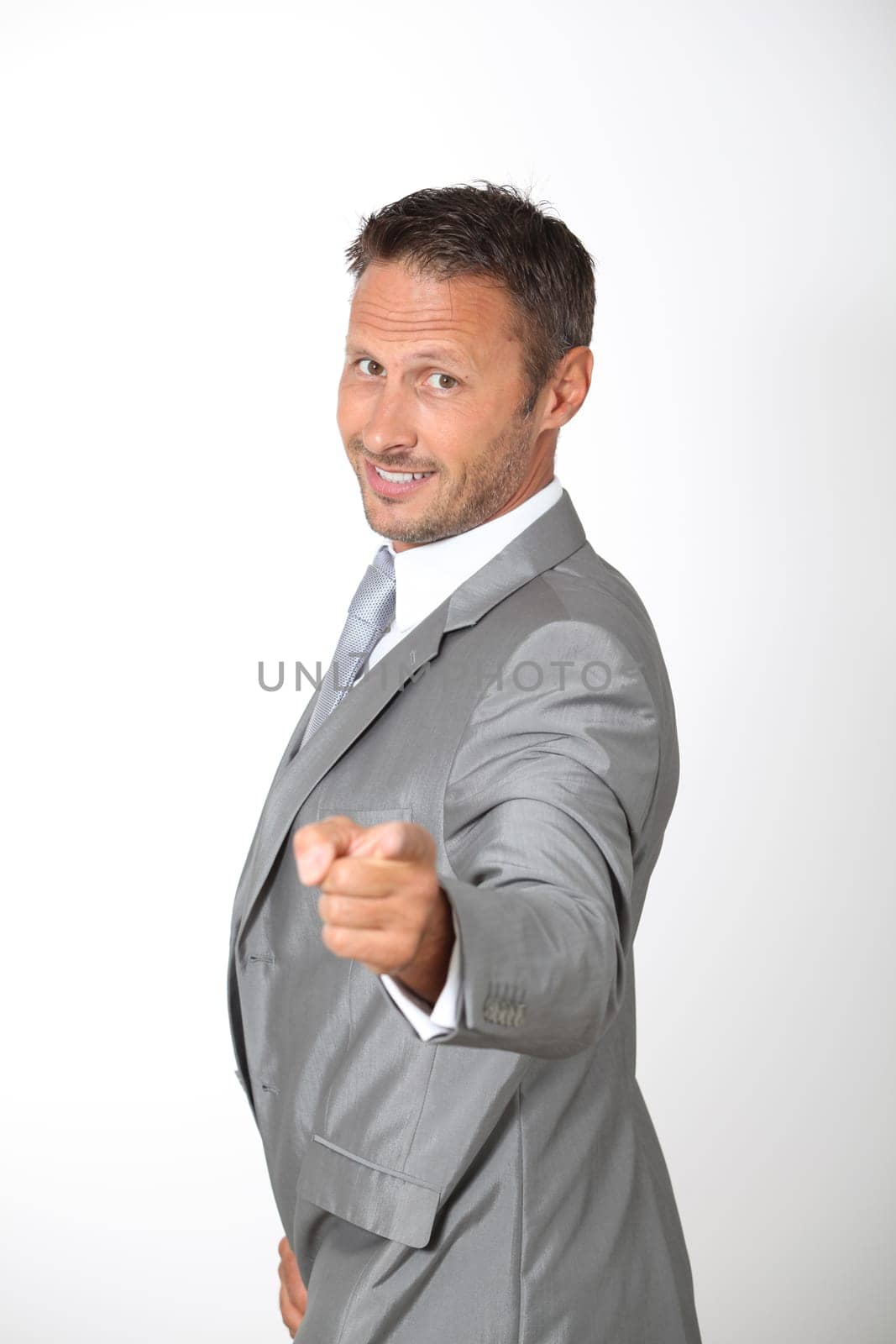 Businessman pointing at camera